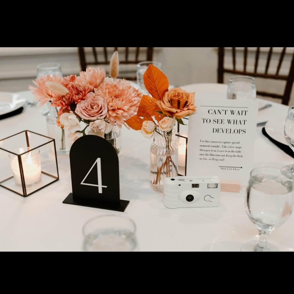 8 black and white acrylic webbing table signs. Table 1-7 with 2 table 1 signs.